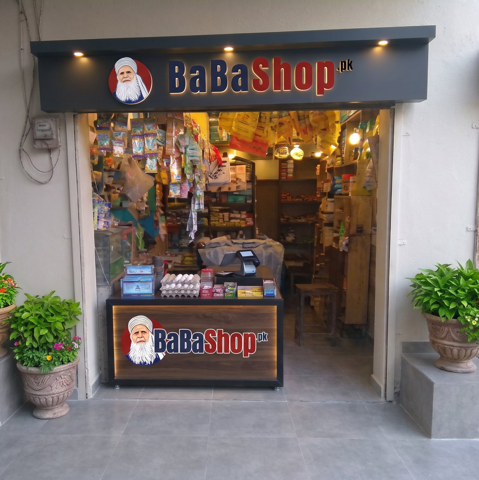 BaBaShop.pk storefront with illuminated signboard and branded counter, Sargodha