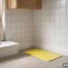 Rat glue pad placed along a kitchen wall to catch rats in the house without poison