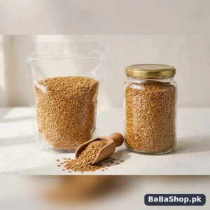 Golden flax seeds alsi in a clear pouch and glass jar with a wooden scoop of shiny alsi seeds